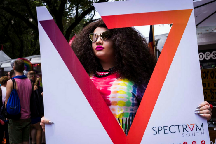 A photo of a festival goer to Spectrum South's booth at Houston Pride 2017.