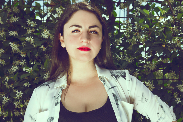 Photo of queer teacher, Dr. Laura McGuire at Axelrad Beer Garden in Houston, Texas.