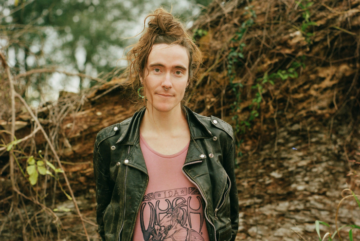 A photo of Nikita Shepard, a research fellow focusing on the history of queer youth at the Don Kelly Research Collection of Gay Literature and Culture at Texas A&M University