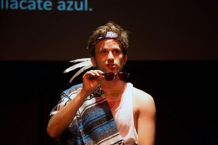 A photo of Josh Inocéncio performing Purple Eyes at Sin Muros Latino Theatre Festival.