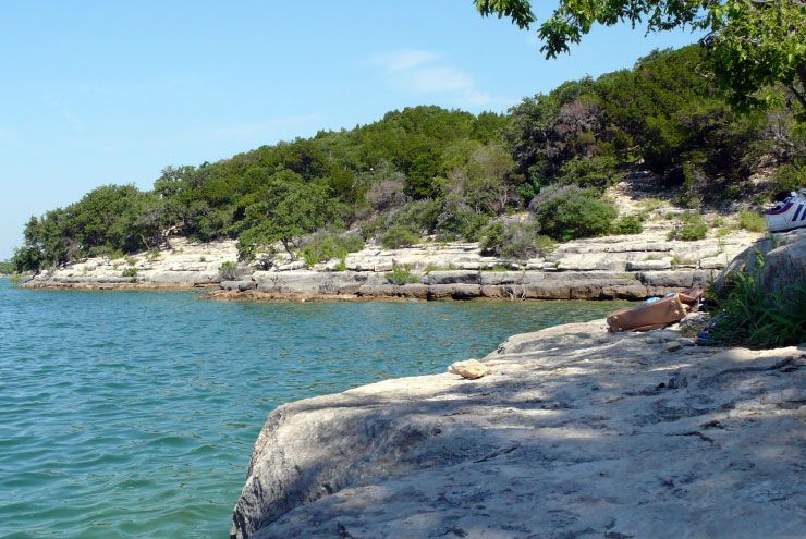 A photo of queer swimming hole Hippie Hollow.