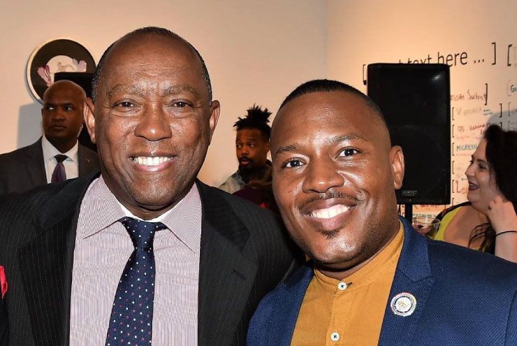 A photo of Harrison Guy with Mayor Sylvester Turner.