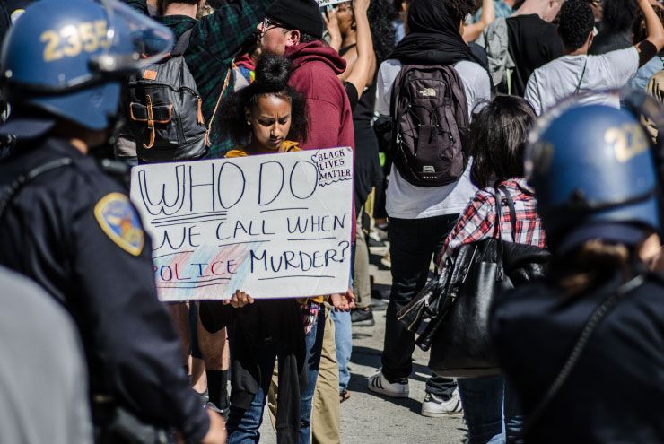 A photo of a protest sign against racism.
