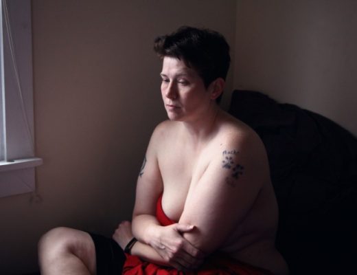 A photo of a queer, disabled person.