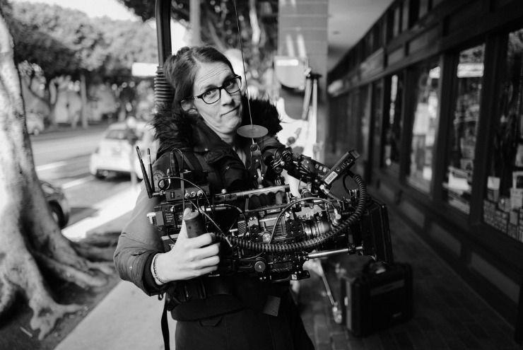 A photo of filmmaker Bianca Cline filming Marcel the Shell.
