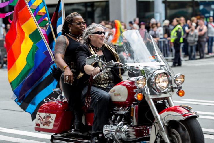 A photo of queer women motorcycling.