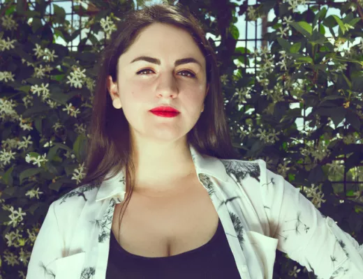 Photo of queer teacher, Dr. Laura McGuire at Axelrad Beer Garden in Houston, Texas.